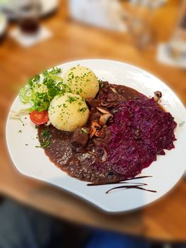 Gourmet game fillet with potato dumplings, goulash garnished