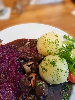 Gourmet game fillet with potato dumplings, goulash garnished