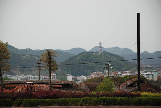 view from the highway of old Chinese temple on the top of the hill