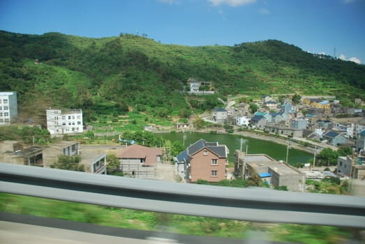 The view from the moving car on the Chinese village
