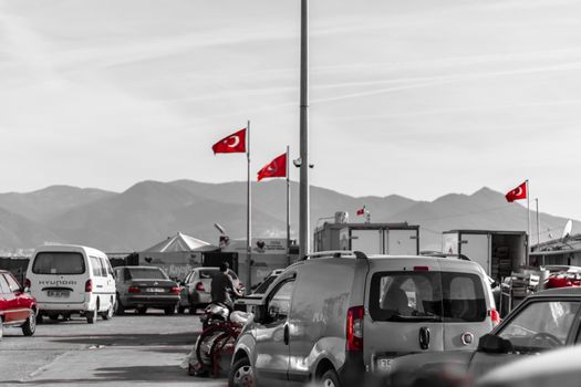 black and white shoot from a fisherman bay - turkish flags are red. photo has taken at izmir/turkey.