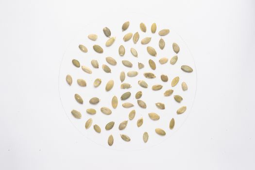 Dry pumpkin seeds isolated on white backgroud. 