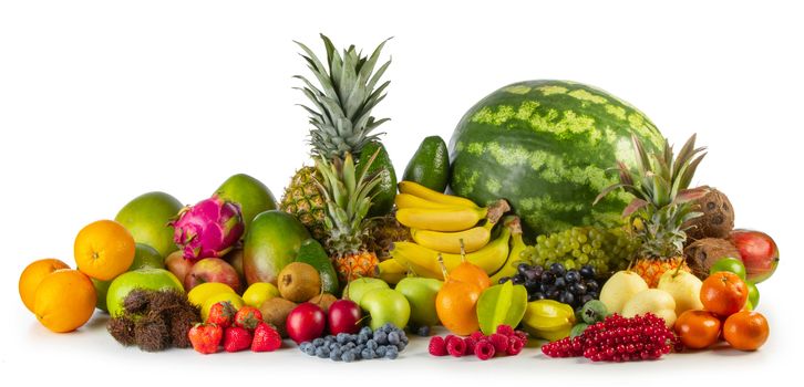 Assorted pile of many tropical colorful fruits harvest studio isolated on white background