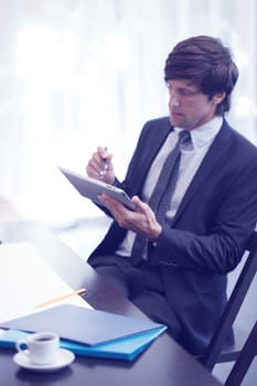 Business man with tablet pc computer in office