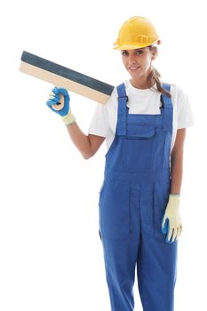 Young beautiful handywoman with masonry trowel isolated on white background