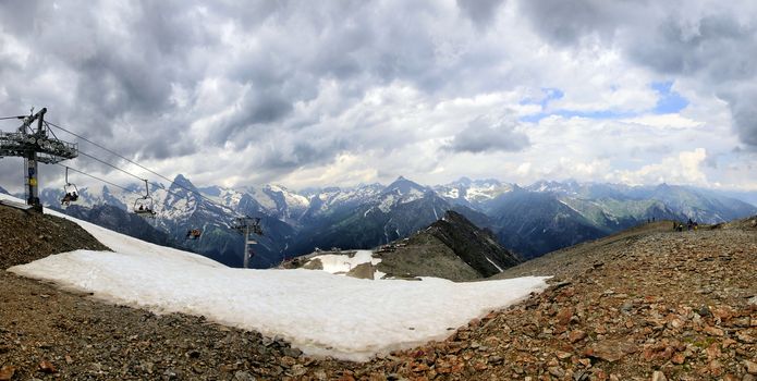 Panorama of mountains scene with dramatic blue sky in national park of Dombay