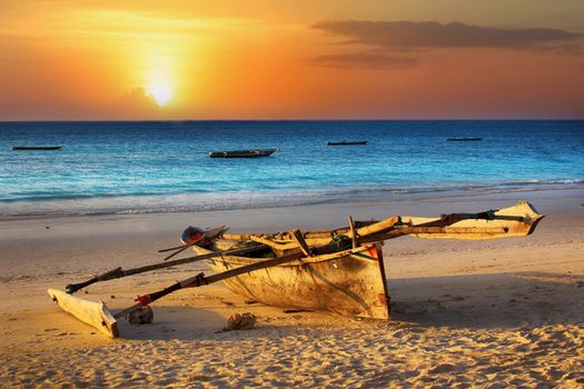 Traditional fishing boat on the ocean at sunset. Zanzibar
