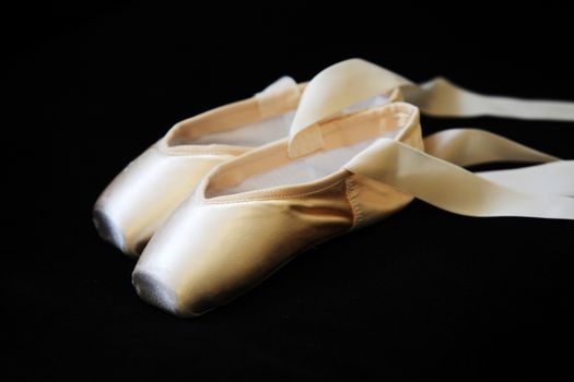 Ballet pointes isolated on a black background