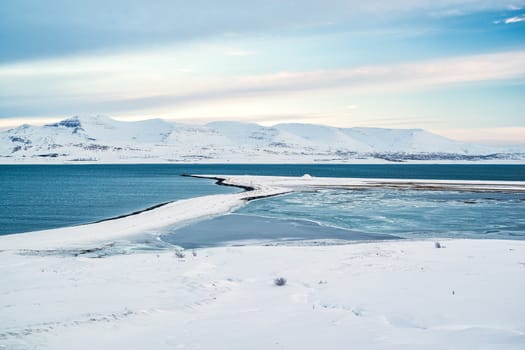 View of the Hvalfjordur in winter with the mountains covered by snow, Iceland