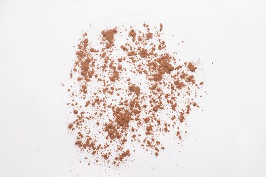 Ground cocoa powder isolated on white backgroud. 