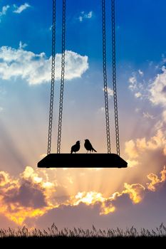 illustration of birds on the swing at sunset