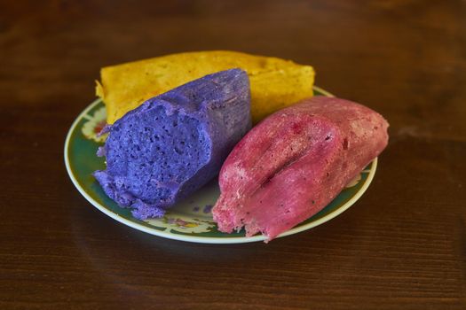 Corn tamales in colors, traditional Mexican food, sweet and chili flavors