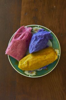 Corn tamales in colors, traditional Mexican food, sweet and chili flavors