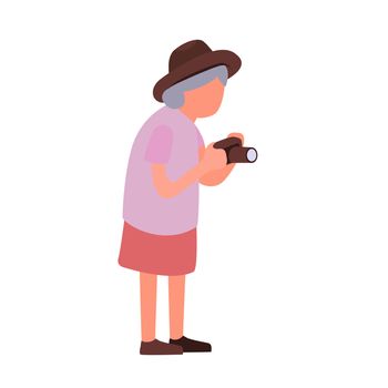 Elderly woman taking pictures of sights. Cartoon female senior character with a camera. Senior activities concept.