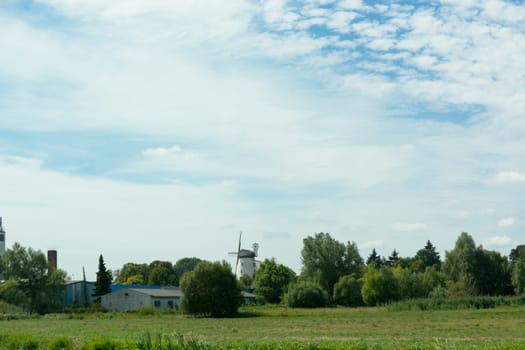 Countryside panorama blue sky Windmill in the background