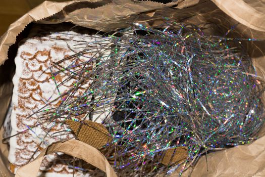 Dispose of Christmas waste. Tinsel in the trash