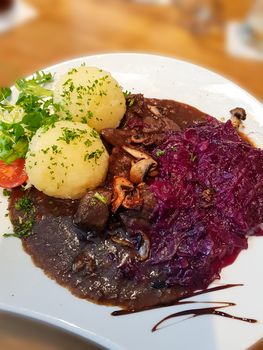 Gourmet game fillet with potato dumplings, goulash garnished