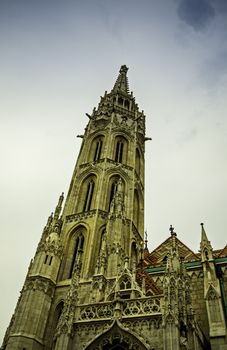 Bottom up view of the spire of Matthias Church in the Fisherman's Bastion in Budapest.