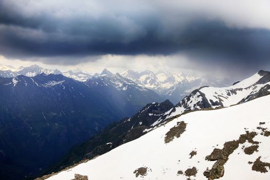 Panorama of mountains scene with dramatic blue sky in national park of Dombay