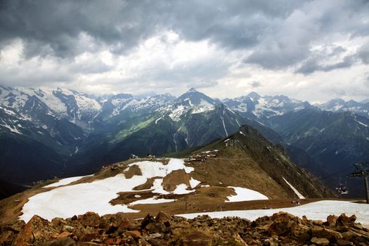 Panorama of mountains scene with dramatic blue sky in national park of Dombay