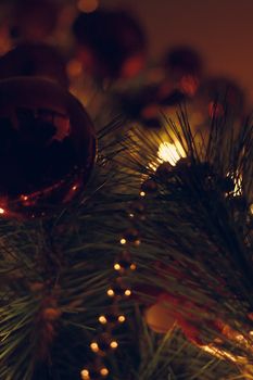 Christmas spheres and lights in dark tones and cat