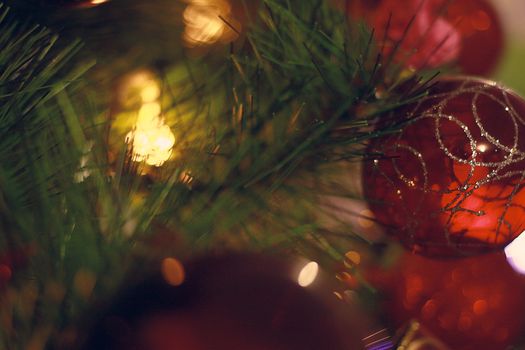 Christmas spheres and lights in dark tones and cat