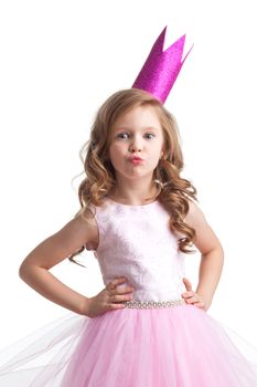Little princess girl in pink dress and crown giving a kiss , studio isolated on white background