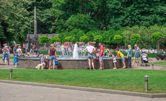 Odessa, Ukraine - 06.09.2019. People spend their families relaxing by the fountain in Gorky Park in Odessa, Ukraine, on a sunny summer day