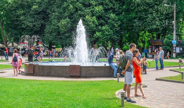 Odessa, Ukraine - 06.09.2019. People spend their families relaxing by the fountain in Gorky Park in Odessa, Ukraine, on a sunny summer day