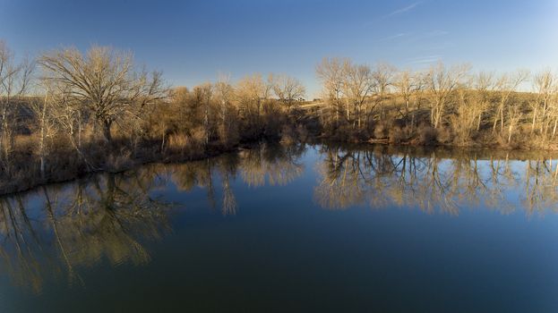 view from over the water looking back into the trees