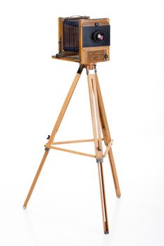 Old wooden photocamera onan isolated studio background
