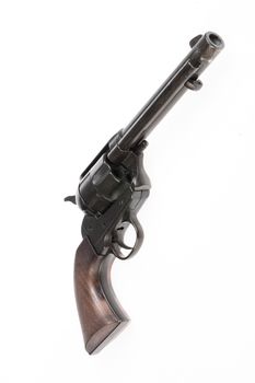 Old revolver on an isolated studio background