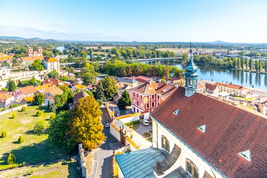 Aerial view of Litomerice and Labe River from cathedral bell tower on sunny summer day, Czech Republic.
