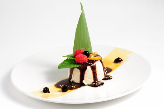 semifredo, italian ice cream dessert with halva, raspberry and chocolate sauce on top
