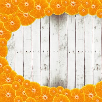 Half of orange fruit on wood background, image for design and other.