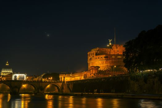 Night scene at the Mausoleum of Hadrian in Rome with river tiber