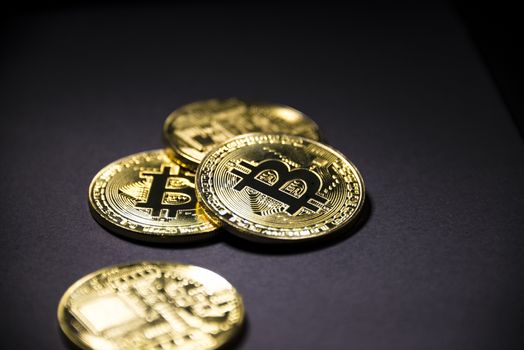 Gold coin Bitcoin on dark background. Cryptocurrency