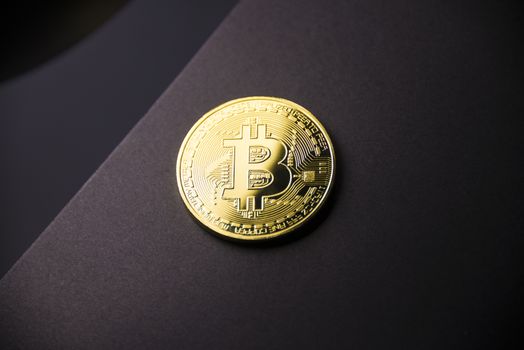 Gold coin Bitcoin on dark background. Cryptocurrency