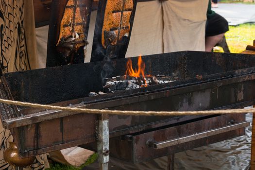 Preparation for smoking salmon over an open fire