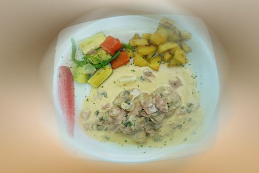Meat tenderloin medallions with campionssouse and fried potatoes. Background motion blur.