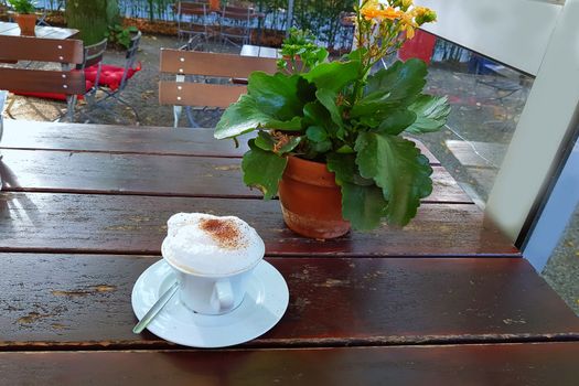 Top view cup of black coffee on a simple wooden table