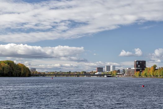 Downtown Umeå, Sweden in Fall with a partly cloudy sky.