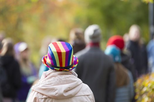 Female with Rainbow Coloured Hat in Pride Parade.