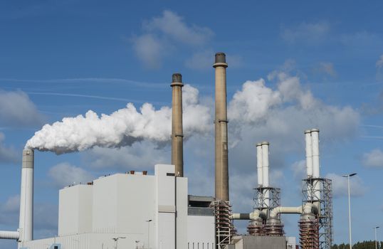 smoke pollution of a power plant in holland near rotterdam in the area europoort