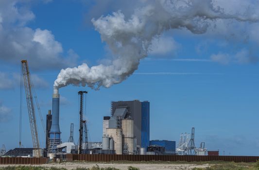 smoke pollution of a power plant in holland near rotterdam in the area europoort