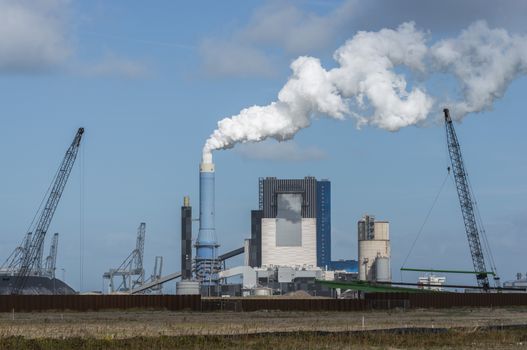 smoke pollution of a power plant in holland near rotterdam in the area europoort