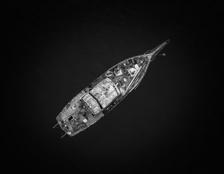 Abandoned rusty old fishing boat sitting in waters near Sydney