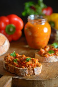 Homemade vegetable salad and bread on wooden table