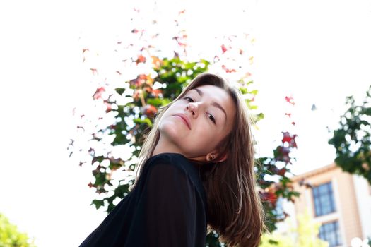 Beauty young woman against white background with tree