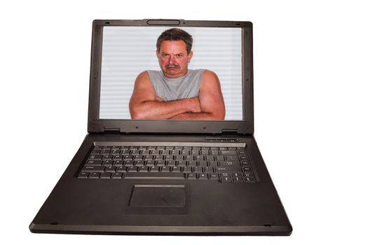 A laptop on the monitor a man with crossed arms. Concept Computer Crime - PC Security and Antivirus and Privacy.